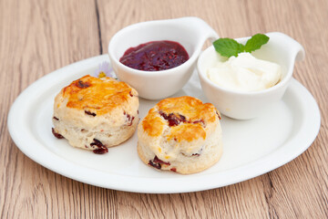 Cranberry scone set with raspberry jam and clotted cream