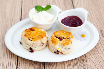Cranberry scone set with raspberry jam and clotted cream