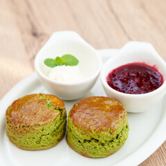 Green tea Matcha scone set with raspberry jam and clotted cream