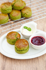Green tea Matcha scone set with raspberry jam and clotted cream