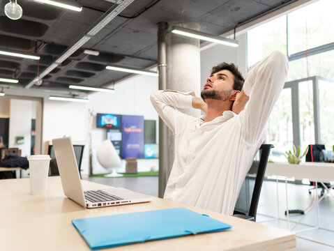 Exhausted man working in modern office
