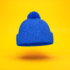 Blue knitted hat floating on a yellow background, 3d render