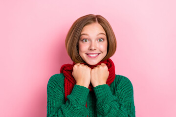 Fototapeta na wymiar Photo of cute funny young lady wear green sweater red scarf smiling isolated pink color background