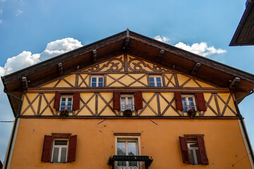 Fototapeta na wymiar View of a mountain house in Fiera di Primiero, Trentino Alto Adige - Italy