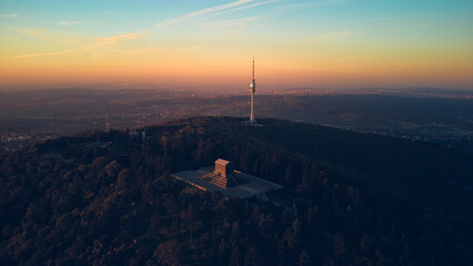 Aerial shot of mountain Avala, communication tower and a monument of unknown hero, symbols of Belgrade, Serbia.