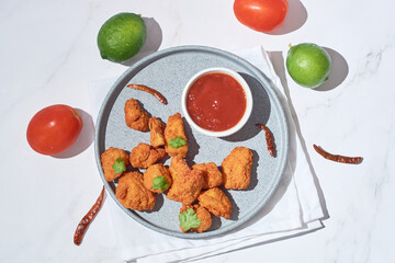 Plate of Mexican boneless chicken wings witch ketchup
