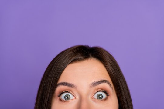 Close up cropped photo of half face impressed girl eyes peeking look curious isolated on violet color background