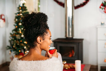 Woman with hot drink on Christmas