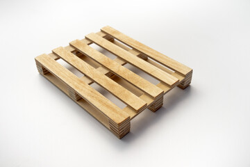 Wooden pallet made of wood on white isolate.Construction pallet on a white background. The stand is made of wood.