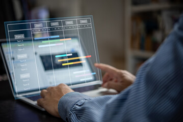 Project manager analyst working with computer in management system to progress planning and make...