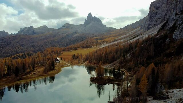 Magical autumn in the Dolomites. Enchanting colors of Lake Federa from above