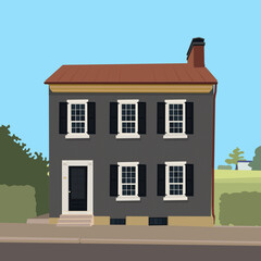 Grey classic two-storey house on the background of nature