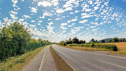 altocumulus floccus clouds over the highway.