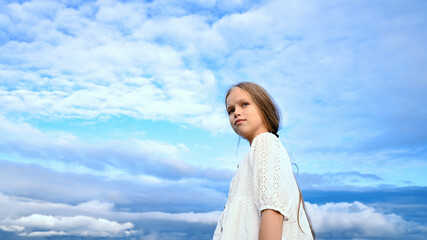 girl and sky, blue clouds