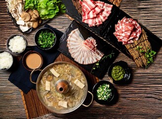 Sauerkraut White Meat Pot Bottom Set with Exclusive, US PRIME Beef Ribs, chopsticks served in pot isolated on table top view of taiwan food