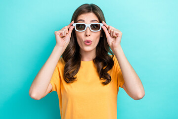 Closeup photo of young excited funny grimace woman wear new glasses cinema film pouted lips reaction unexpected isolated on cyan color background