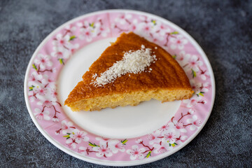 Delicious turkish pastry with syrup revani over a white plate