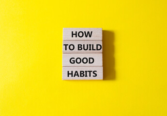 How to build good habits symbol. Concept words How to build good habits on wooden blocks. Beautiful yellow background. Business and How to build good habits concept. Copy space.