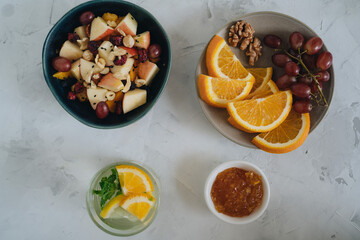 Plates with fruit on white background