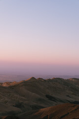 sunset over the mountains in jordan desert