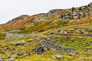 Flüela, Flüelapass, Alpen, Passhöhe, Passstrasse, Bergstrasse, Steinschlag, Felsen, Wintereinbruch, Wanderweg, Graubünden, Herbst, Herbstfarben, Schweiz