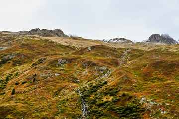 Flüela, Flüelapass, Alpen, Passhöhe, Passstrasse, Bergstrasse, Steinschlag, Felsen, Wintereinbruch, Wanderweg, Graubünden, Herbst, Herbstfarben, Schweiz