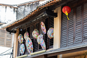 Chinese attributes in the house decoration: lantern and umbrellas, Penang, Malaysia