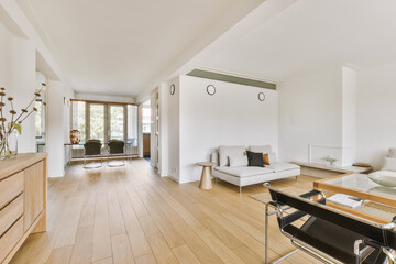 Contemporary minimalist style interior design of light studio apartment with wooden table and...