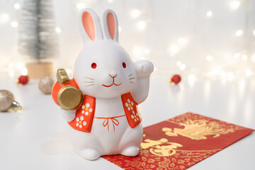Chinese Lunar New Year concept. Greeting for Chinese Rabbit New Year with red envelope. The Chinese...