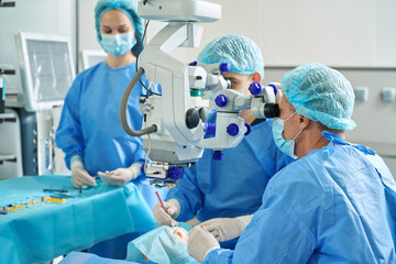 Naklejka na ściany i meble Close up photo of doctors on surgery