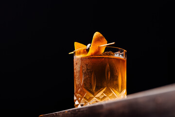 old fashioned cocktail classic bourbon whiskey and bitters, orange peel and cherry as garnish - obrazy, fototapety, plakaty