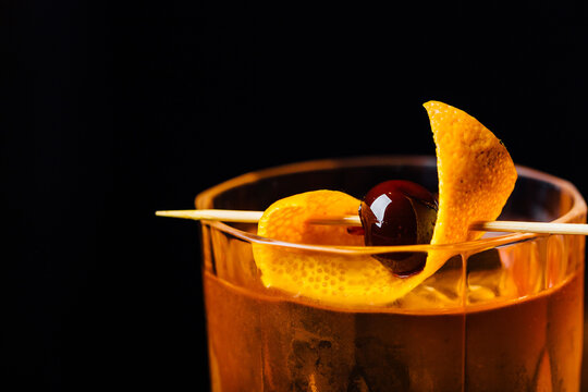 old fashioned cocktail detail shot on a black background