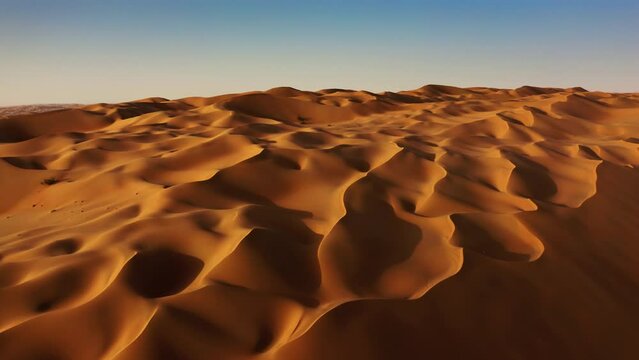 Sand dunes in Arabian desert aerial view. Liwa, Abu Dhabi, United Arab Emirates