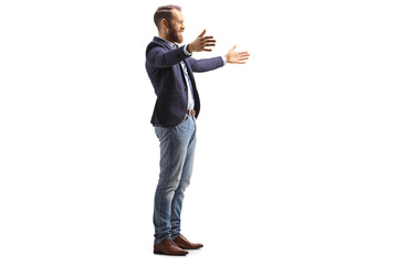 Full length profile shot of a man waiting with arms wide open