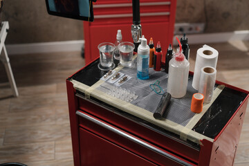 Close-up - tattoo equipment in a tattoo studio, tattoo machine needles