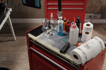 Close-up - tattoo equipment in a tattoo studio, tattoo machine needles