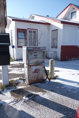 abandoned gas station and pump