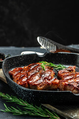 Juicy Beef steak with rosemary and spices. Grilled meat, bbq, barbecue. vertical image. place for text