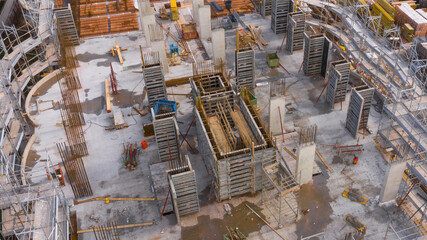 Aerial view on a building under construction. The pillars and the internal structure are clearly...