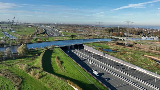 Aqueduct Vechtzicht Muiden in The Netherlands. Infrastructure road, highway. river, waterway crossing and tunnel. connection between Diemen and Almere. Aerial drone view.