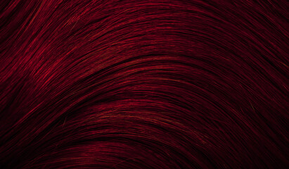 Dark red hair close-up as a background. Women's long brown hair. Beautifully styled wavy shiny...