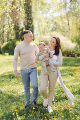 Fototapeta premium Family Enjoying Walk In Park