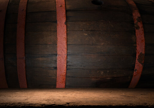 Wooden barrels with whiskey in dark cellar. High quality photo