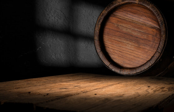 Wooden barrels with whiskey in dark cellar. High quality photo