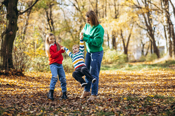 Mother with children walking in park
