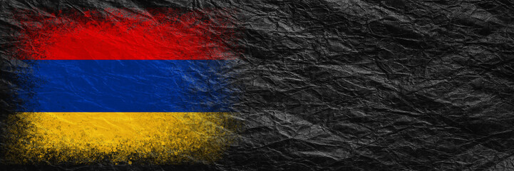 Flag of Armenia. Flag is painted on black crumpled paper. Paper background. Copy space. Textured background