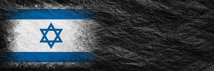 Flag of Israel. Flag is painted on black crumpled paper. Paper background. Copy space. Textured background