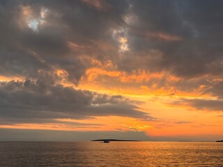 Naklejka na ściany i meble Fantastic orange sunset at the sea, seascape view