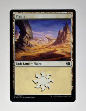 Hamburg, Germany - 11192022: photo of the English Magic The Gathering trading papercard Plains from the brothers war set. The Gathering is published by Wizards of the Coast.