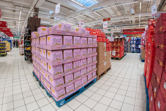 Cuneo, Italy - November 18, 2022: pallets with packs of panettone cake Bauli, an important Italian brand from Verona, in the Conad supermarket for sale before the Christmas holidays